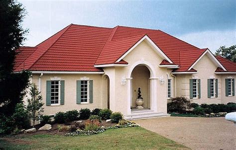 yellow house with red metal roof|red tile roof house colors.